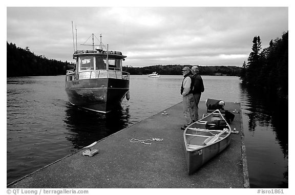 Canoists waiting for pick-up by the ferry at Chippewa harbor. Isle Royale National Park (black and white)
