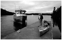 Canoists waiting for pick-up by the ferry at Chippewa harbor. Isle Royale National Park ( black and white)