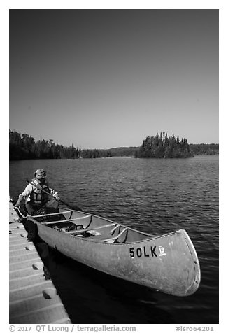 Canoist at dock, Tobin Harbor. Isle Royale National Park (black and white)