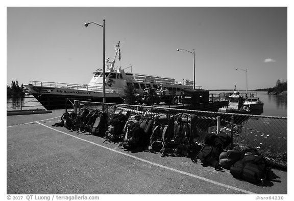 Backpacks lined up on dock, Rock Harbor. Isle Royale National Park (black and white)