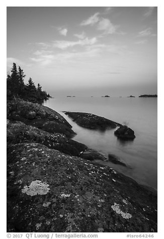 Lichen-colored rocks on Rock Harbor shore, sunset. Isle Royale National Park (black and white)