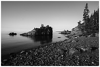 Rocky beach, offshore islet, and Lake Superior, Mott Island. Isle Royale National Park ( black and white)