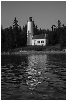 Rock Harbor Lighthouse with tree shadaow and reflection. Isle Royale National Park ( black and white)