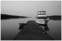 Dock with motorboat and yacht at dusk, Moskey Basin. Isle Royale National Park ( black and white)