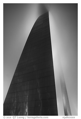 Profile view of Gateway Arch with top in clouds at night. Gateway Arch National Park (black and white)