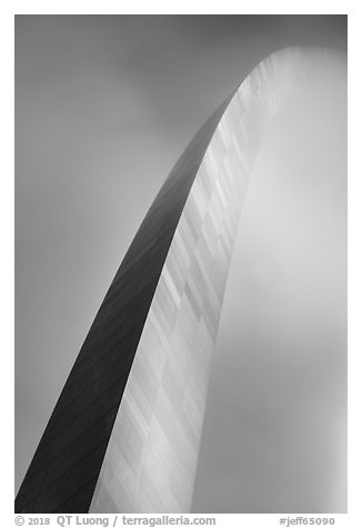 Curve of Gateway Arch on foggy night. Gateway Arch National Park (black and white)