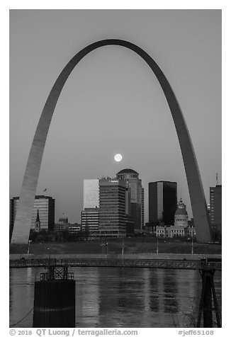 Moonset framed by Arch across Mississippi River. Gateway Arch National Park (black and white)