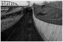 Curved south railroad walls and tunnel. Gateway Arch National Park ( black and white)