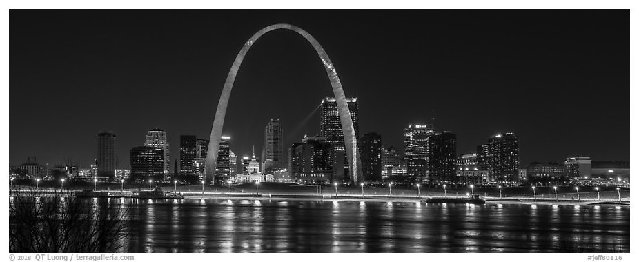 St Louis skyline across Mississippi River at night. Gateway Arch National Park (black and white)