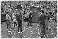 Ranger pointing to cave entrance to tourists. Mammoth Cave National Park ( black and white)