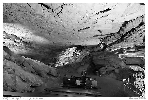 Tourists listening at ranger in large room inside cave. Mammoth Cave National Park, Kentucky, USA.