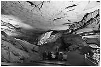 Tourists listening at ranger in large room inside cave. Mammoth Cave National Park ( black and white)