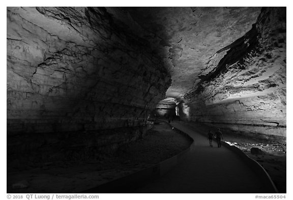 Couple walking down path in cave. Mammoth Cave National Park (black and white)