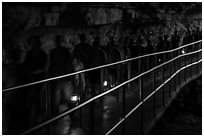 Motion blurred visitors holding lanterns. Mammoth Cave National Park ( black and white)