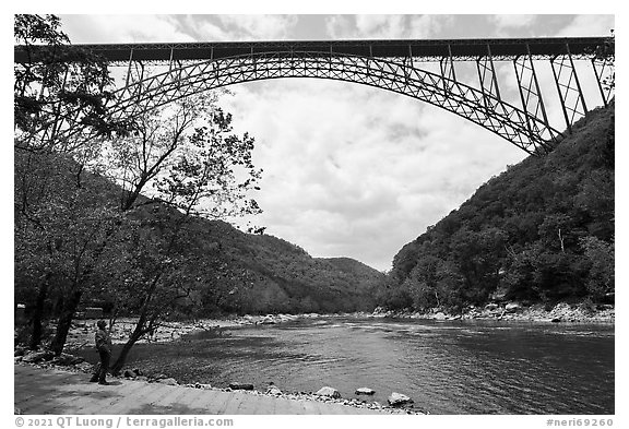 Visitor looking, New River Gorge Bridge. New River Gorge National Park and Preserve (black and white)