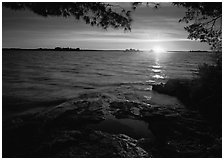 Sun rising over Kabetogama Lake. Voyageurs National Park, Minnesota, USA. (black and white)