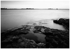 Lake and eroded granite at sunrise. Voyageurs National Park, Minnesota, USA. (black and white)