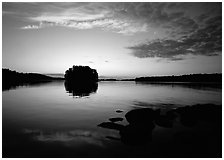 Kabetogama lake sunset with tree-covered islet. Voyageurs National Park, Minnesota, USA. (black and white)