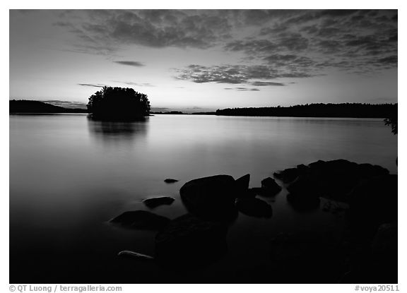 Kabetogama lake sunset with eroded granite and tree-covered islet. Voyageurs National Park (black and white)