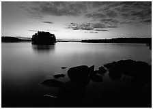 Kabetogama lake sunset with eroded granite and tree-covered islet. Voyageurs National Park, Minnesota, USA. (black and white)