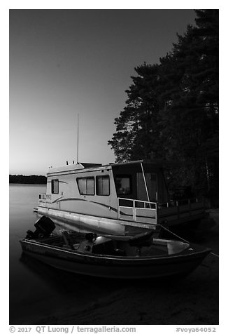 Motorboat and houseboat at dusk, Houseboat Island, Sand Point Lake. Voyageurs National Park (black and white)