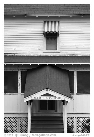 Kettle Falls Hotel door and window with red and white stripes awning. Voyageurs National Park (black and white)