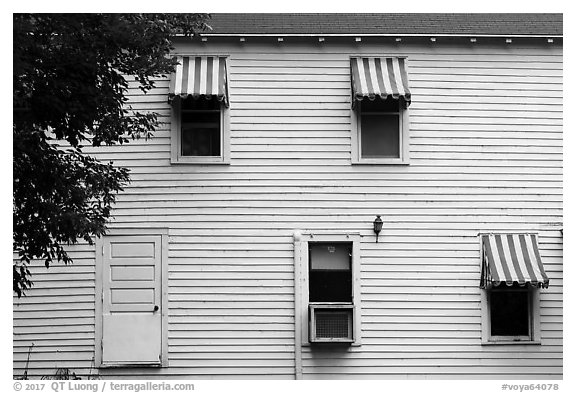 Kettle Falls Hotel wall with with red and white stripes awnings. Voyageurs National Park (black and white)