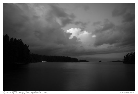 Anderson Bay at dusk, with lights of houseboat. Voyageurs National Park (black and white)