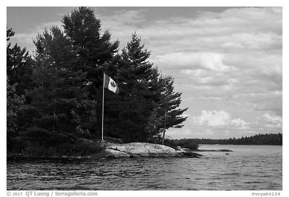Islet with Canadian flag, Namakan Lake. Voyageurs National Park (black and white)