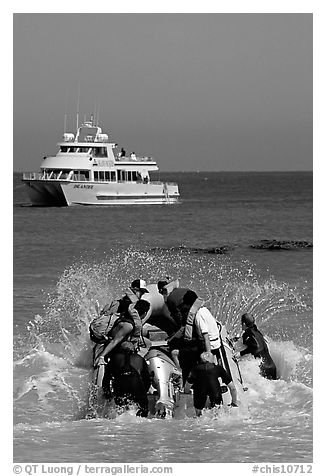 Skiff crossing  surf to join tour boat, Cuyler harbor, San Miguel Island. Channel Islands National Park, California, USA.