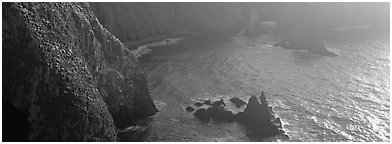 Steep cove with glittering water, Anacapa Island. Channel Islands National Park (Panoramic black and white)