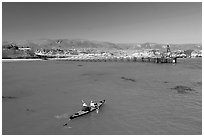 Kayakers in Bechers Bay, Santa Rosa Island. Channel Islands National Park, California, USA. (black and white)