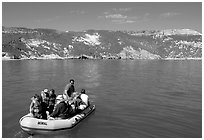 Campers using a skiff to land, San Miguel Island. Channel Islands National Park, California, USA. (black and white)