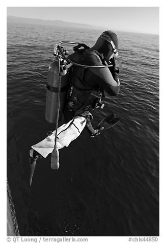 Scuba diver jumping from boat. Channel Islands National Park, California, USA.