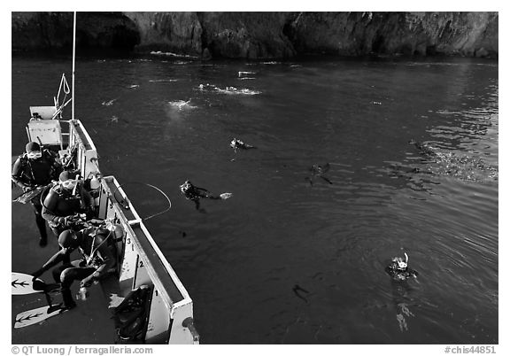 Diving boat and scuba divers in water, Annacapa. Channel Islands National Park, California, USA.