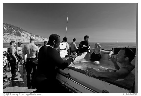 Divers in hot tub aboard the Spectre dive boat, Santa Cruz Island. Channel Islands National Park, California, USA.