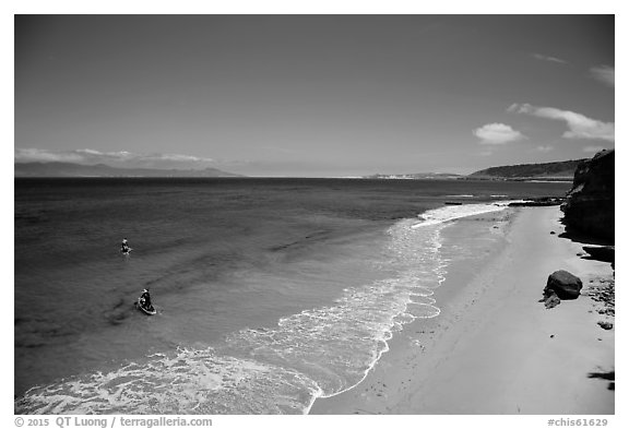 Paddle boarders leaving beach, Santa Rosa Island. Channel Islands National Park (black and white)