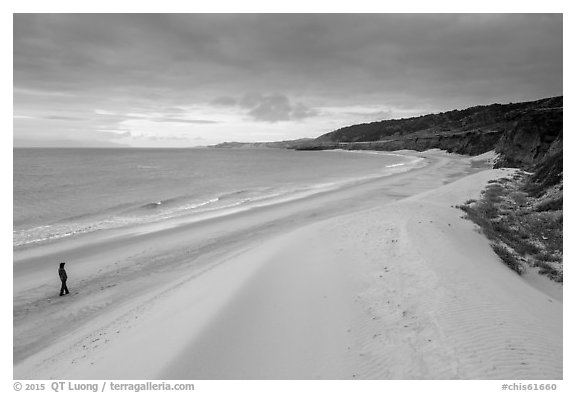 Visitor looking, Water Canyon Beach, Santa Rosa Island. Channel Islands National Park (black and white)