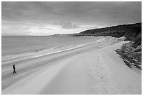 Visitor looking, Water Canyon Beach, Santa Rosa Island. Channel Islands National Park ( black and white)