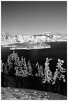 Trees, Wizard Island, and Lake in winter, afternoon. Crater Lake National Park, Oregon, USA. (black and white)
