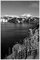 Lake rim in winter with blue skies. Crater Lake National Park, Oregon, USA. (black and white)