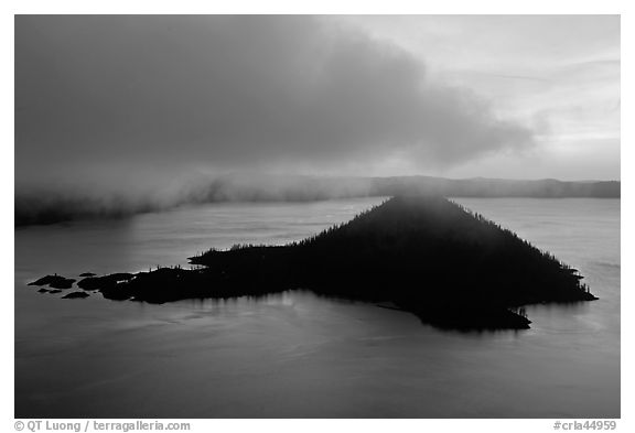 Cloud above Wizard Island at dawn. Crater Lake National Park, Oregon, USA.