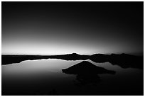 Wide view of lake with dawn on eastern horizon. Crater Lake National Park ( black and white)