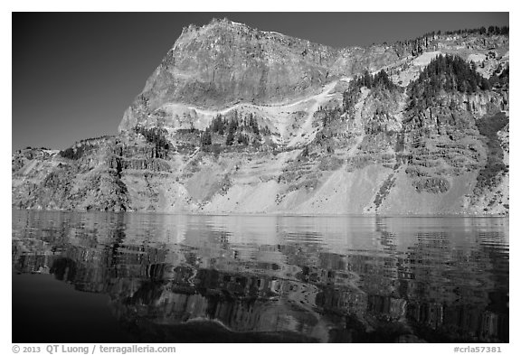 Llao Rock reflected in rippled water. Crater Lake National Park (black and white)