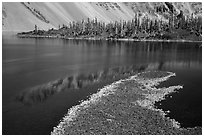 Lava rocks and reflections in Fumarole Bay, Wizard Island. Crater Lake National Park ( black and white)