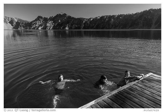 Girls swim from Wizard Island dock. Crater Lake National Park (black and white)