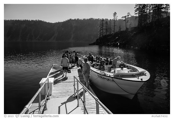 Visitors embark on tour boat at Wizard Island boat dock. Crater Lake National Park (black and white)