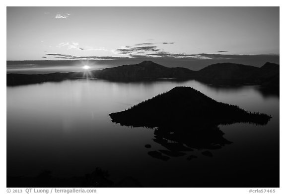 Sun rising below cloud band. Crater Lake National Park (black and white)