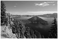 Visitor looking, Wizard Island and lake. Crater Lake National Park ( black and white)
