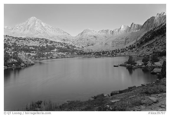 Columbine Peak, Palissades, and Mt Giraud at dusk above lake. Kings Canyon National Park, California, USA.